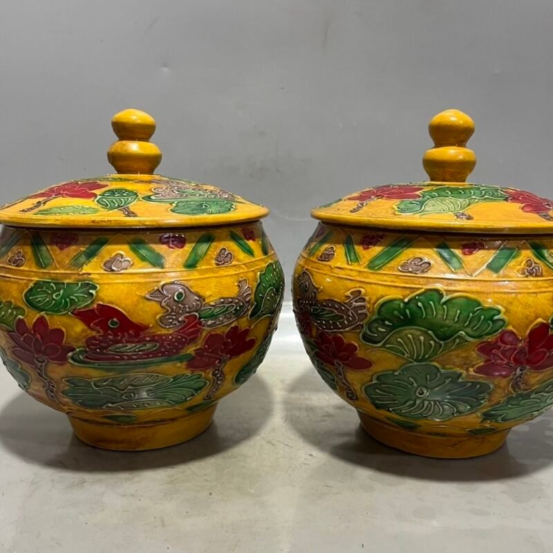 Antique Chinese Yellow-Ground Sancai Relief Jar Pair (2) Antique Chinese Yellow Ground Sancai Relief Jar Pair (2)