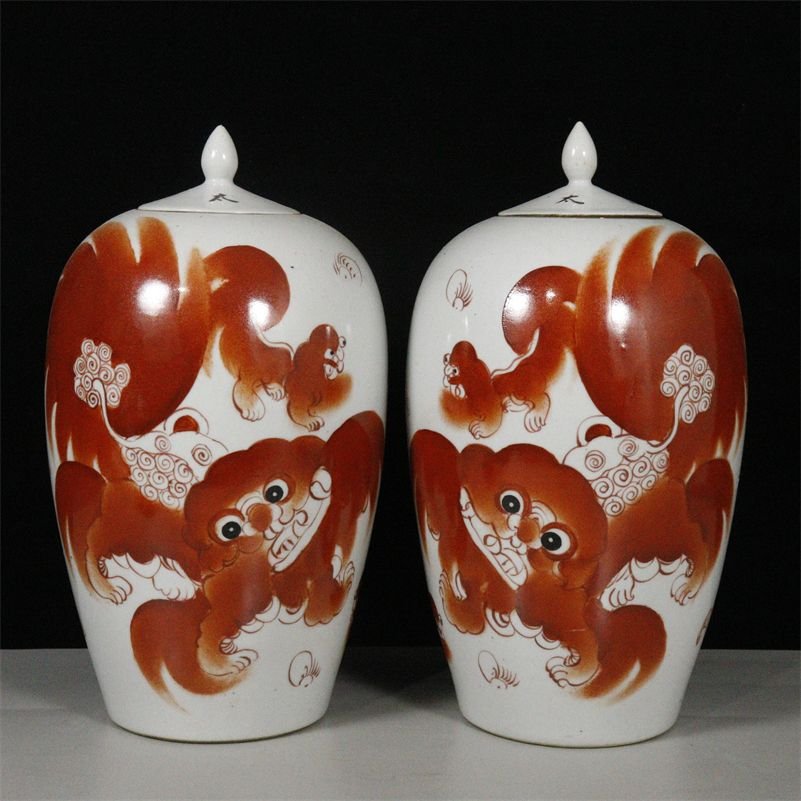 Pair of Iron Red Porcelain Ginger Jars with Lion Motif (1) Pair of Iron Red Porcelain Ginger Jars with Lion Motif (1)